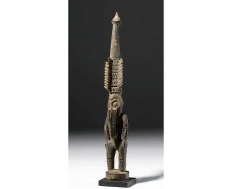 Papua New Guinea, Ramu River area, Wokam Village, early to mid 20th century CE. A small hand-carved wooden standing figure. T