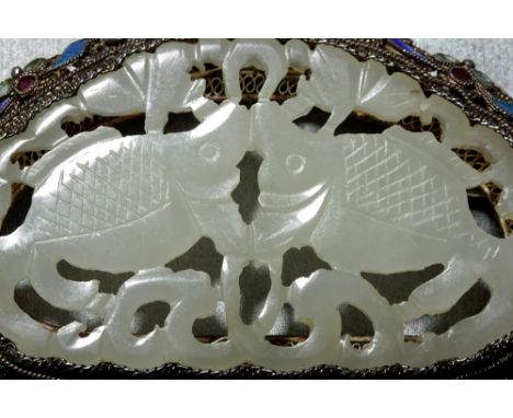 China, ca. early 20th century CE. A stunning Chinese brooch comprised of an intricately carved translucent white jade central