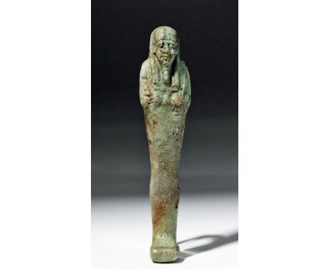 Egypt, Third Intermediate Period, ca. 1070 to 712 BCE. This is a late period ushabti (shabti), made of a green faience and mu