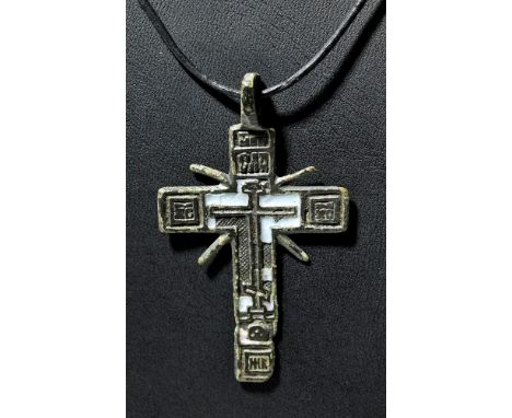 Russia, ca. 16th to 17th century.  Wearable and early Russian cross in deeply patinated bronze with remains of original ename