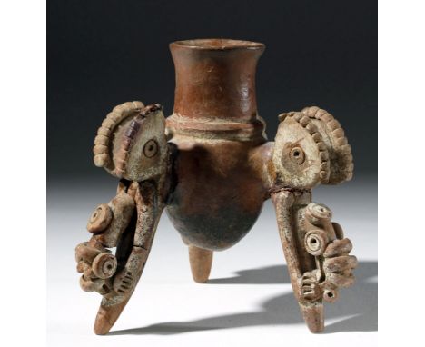 Pre-Columbian, Costa Rica, ca. 500 to 800 CE. A wonderfully abstract pottery tripod vessel, painted in an earthy red and a br