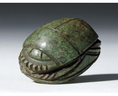 Egypt, New Kingdom / Third Intermediate Period, ca. 1550 to 712 BCE. This is a large greenstone "heart" scarab with carved de