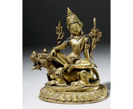 Central Asia, Tibet, 19th century CE. A heavy gilded bronze statue with a fantastic depiction of the Hindu god Shiva seated c