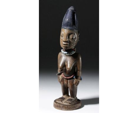 West Africa, Yoruba culture, Ibeji, ca. early 20th century. A nice example of a deceased female twin figure, known as an Ibej