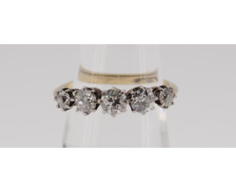 18CT GOLD FIVE STONE DIAMOND RING the five claw set stones totalling 0.75cts approximately (visual estimate). Ring size L, 2.