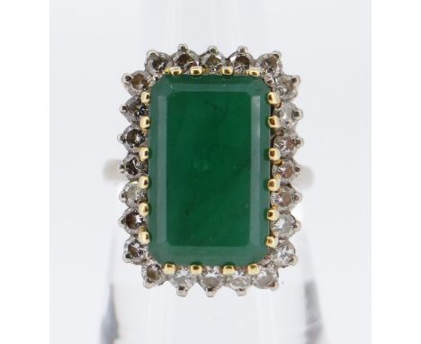 18CT GOLD EMERALD &amp; DIAMOND CLUSTER RING, the large rectangular emerald (1.5 x 0.9cms) surrounded by twenty four diamonds