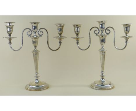 PAIR GEORGE V SILVER THREE-LIGHT CANDELABRA, Thomas Bradbury and Sons, London 1917, with reeded drip pans and collars, fluted