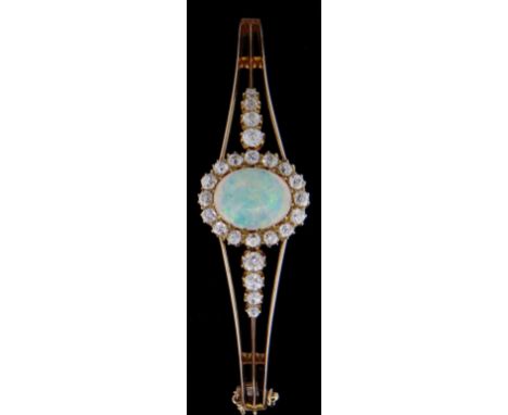 LADIES YELLOW GOLD OPAL & DIAMOND CLUSTER BANGLE, the central opal (11mm x 9mm) surrounded by sixteen diamonds (0.04ct each) 