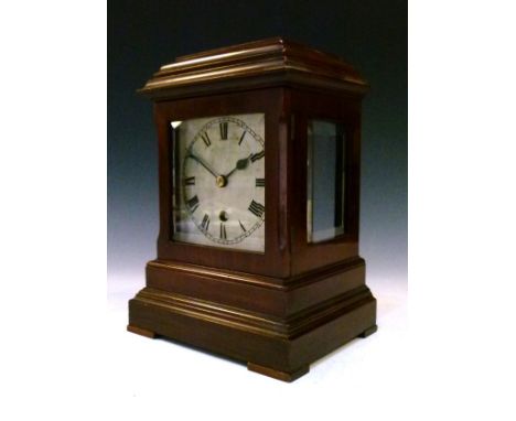 Early 20th Century mahogany cased mantel clock having bevelled glazed panels, silvered dial with Roman numerals, brass moveme