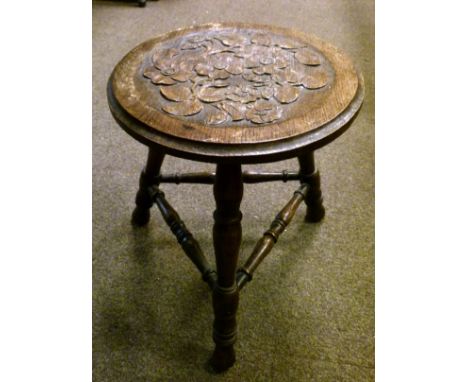 Late 19th/early 20th Century carved triple fold firescreen with scrolling foliate decoration, a similarly carved oak circular