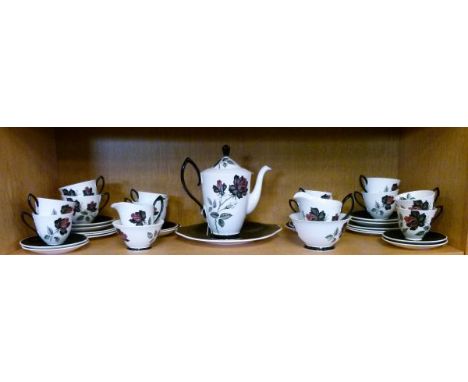 Royal Albert bone china tea service having transfer printed decoration of roses against a white and black ground   Condition: