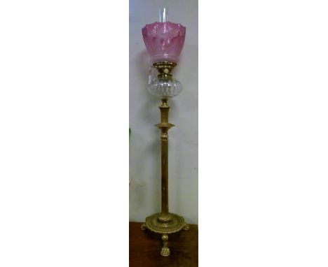 Late 19th/early 20th Century oil lamp having a clear cut glass reservoir on a slender brass square reeded column with circula
