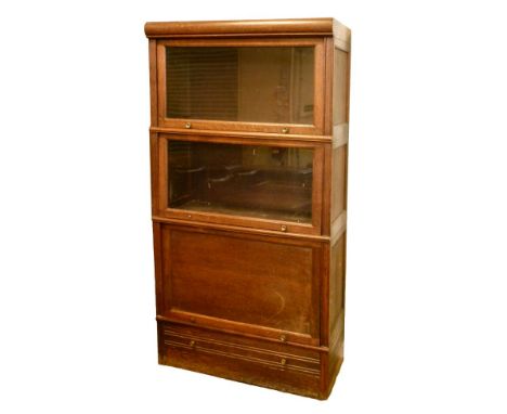 Early 20th Century oak Globe Wernicke style three section bookcase having two up-and-over glazed doors, the base with blind p