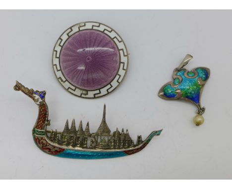 A hallmarked silver and enamel Art Nouveau pendant, hallmark worn, possibly Birmingham 1910 by Smith &amp; Ewen, and two silv