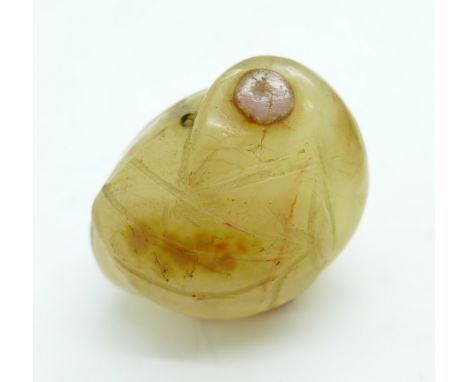 A carved jade netsuke