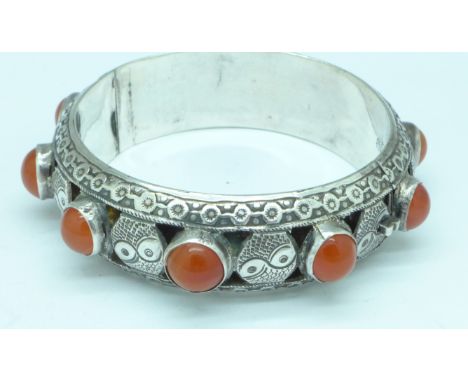 A silver stone set bangle, marked Silver, China, Bee