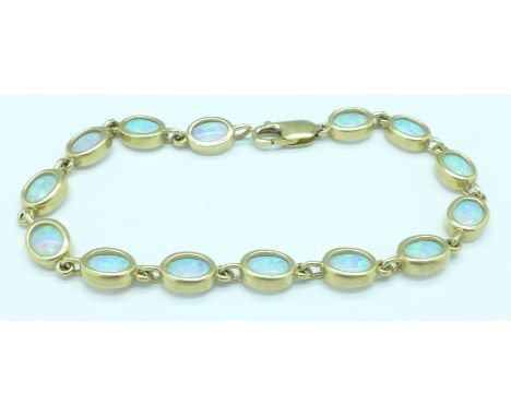 A 9ct gold and synthetic opal bracelet, 10.4g