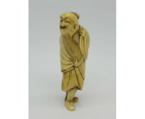 An 18th Century ivory netsuke of a hermit