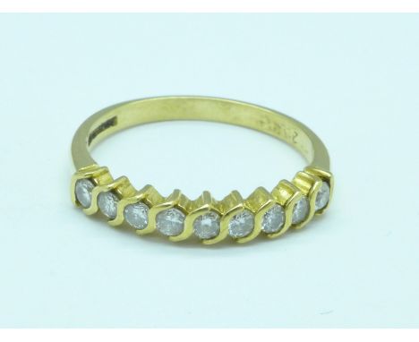 An 18ct gold, nine stone diamond ring, 3.2g, Q