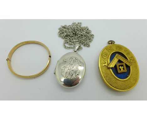 A Victorian locket on a silver chain, a rolled gold bangle and a Masonic pendant