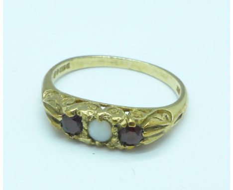 A 9ct gold, garnet and opal ring, 2.5g, O