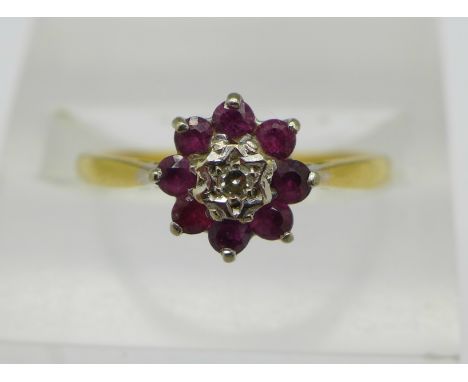 An 18ct gold, diamond and ruby ring, 2.6g, P