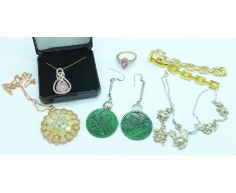 A pair of carved earrings, a pink jade pendant, a pink quartz ring, a synthetic opal pendant, etc.