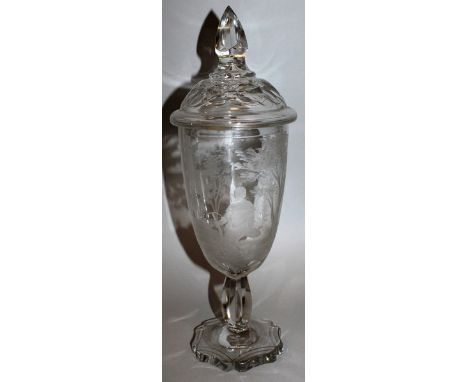 A GOOD BOHEMIAN CUT GLASS URN AND COVER engraved with deer hunting. 17ins high.