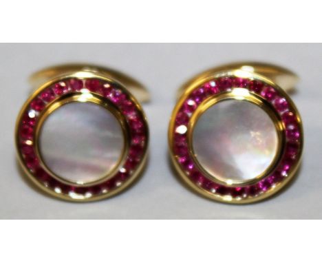 A GOOD PAIR OF RUBY AND MOTHER-OF-PEARL 9CT YELLOW GOLD CUFFLINKS.