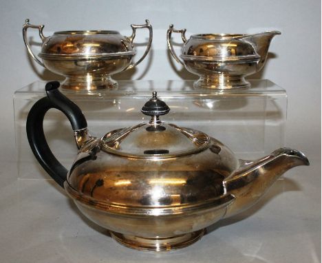 A THREE PIECE CIRCULAR TEA SET, comprising teapot, sugar basin and milk jug.