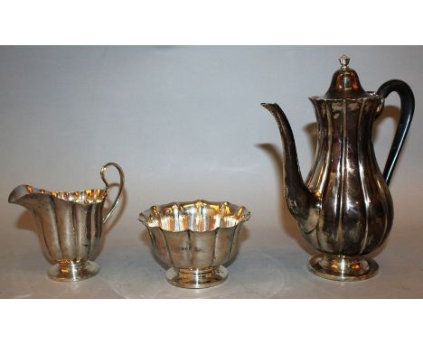A CRIGHTON BROS STERLING SILVER THREE PIECE COFFEE SET, fluted form, comprising coffee pot, sugar basin and cream jug Weight 