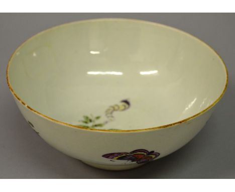 AN 18TH CENTURY RARE WORCESTER BOWL painted with three large butterflies and the green sprigs of leaves, the interior with a 