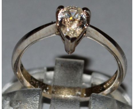 A GOOD SOLITAIRE DIAMOND RING, pear shaped, approx. .78cts, colour H-I/V.S., set in 18ct yellow gold.
