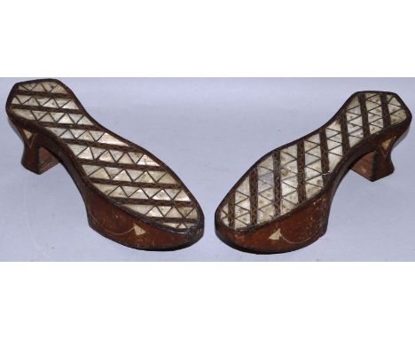 A PAIR OF TURKISH WOODEN AND MOTHER-OF-PEARL BATH SHOES.