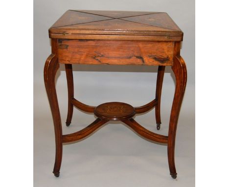 AN EDWARDIAN ROSEWOOD INLAID SQUARE TOP ENVELOPE CARD TABLE, green baize interior, curving legs with uniting stretchers and p