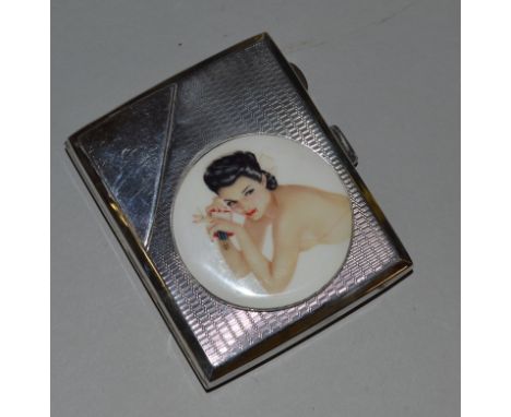 AN ENGINE TURNED SILVER CIGARETTE CASE with circular nude Birmingham 1929.