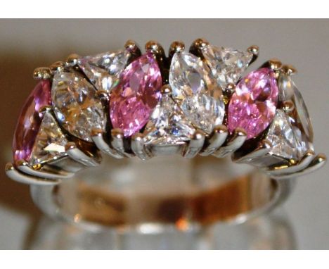 A PINK AND BRILLIANT HALF HOOP RING.
