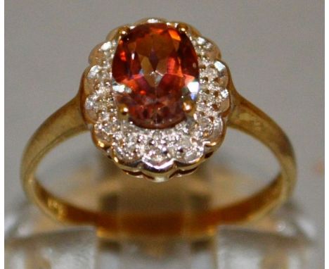 A GOOD AMBER OVAL DRESS RING set in 9ct gold.