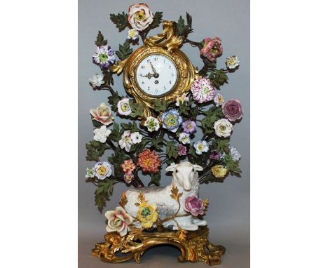 A SUPERB 18TH CENTURY FRENCH ORMOLU AND PORCELAIN MANTLE CLOCK with drum movement in a case with porcelain flowers, the base 