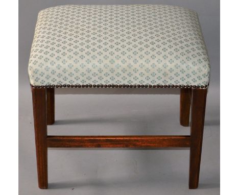 A GEORGIAN MAHOGANY STOOL with padded top on tapering legs. 1ft 9ins wide.
