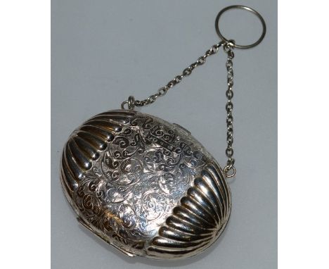 A VICTORIAN SILVER ENGRAVED OVAL PURSE AND CHAIN. Birmingham 1885.