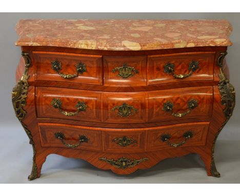A GOOD LOUIS XVI STYLE KINGWOOD MARBLE TOP BOMBE COMMODE fitted with three small drawers over two long drawers with ormolu ha