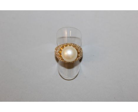 A DIAMOND, PEARL AND GOLD RING.