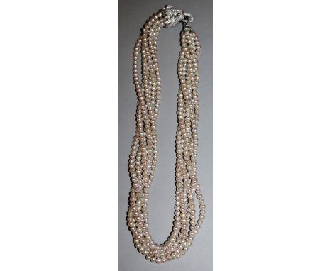 A SIX ROW FRESHWATER PEARL NECKLACE with stone set sterling silver panther clasp.