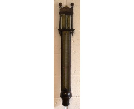 AN EARLY 18TH CENTURY WALNUT STICK BAROMETER with engraved brass dial. 38ins high.