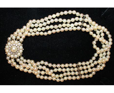 A SUPERB FOUR ROW PEARL CHOKER with 18ct yellow gold, pearl and diamond clasp, set with twelve diamonds.