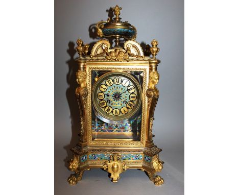 A GOOD 19TH CENTURY FRENCH CHAMPLEVE ENAMEL, ORMOLU AND ONYX CLOCK with eight day movement striking on a bell, with urn finia