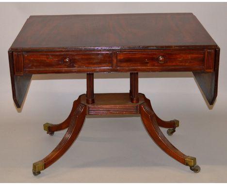 A 19TH CENTURY MAHOGANY SOFA TABLE, the rectangular top with cut corners to the flaps, two frieze drawers on four turned and 