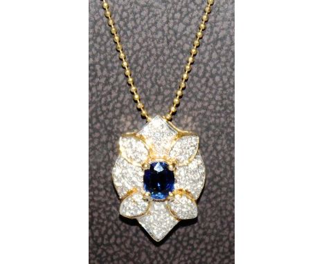 A NICE SAPPHIRE AND DIAMOND PENDANT on a fine gold chain.