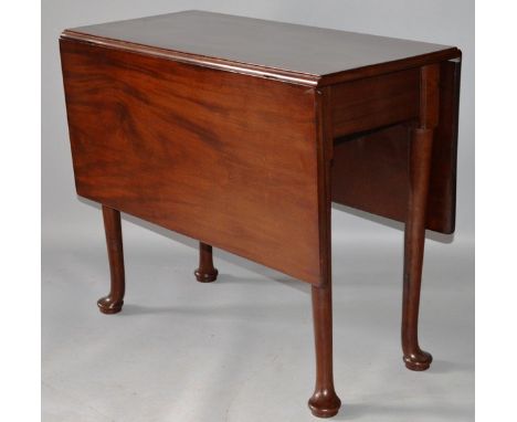 A GEORGE III MAHOGANY DROP FLAP DINING TABLE with two flaps and gate-leg ending in pad feet. 3ft 8ins extended.